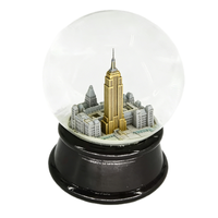 Globe à neige en résine de luxe du Empire State Building de New York avec base noire pour cadeaux et collections haut de gamme