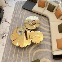 Table basse de luxe moderne haut de gamme Sculpture miroir doré Table basse de salon en acier inoxydable pour villa