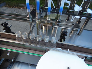 เครื่องบรรจุของเหลวแบบมีสายบรรจุขวดแก้วแบบอัตโนมัติขนาด100มล. - Product Image 2