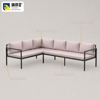 Canapé d'angle extérieur en forme de L avec structure en métal noir et coussins rose poudré, mobilier de jardin