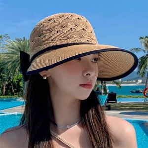 Chapeau de soleil pliable en paille tressée avec nœud ajouré pour femme – Vente en gros - Product Image 3