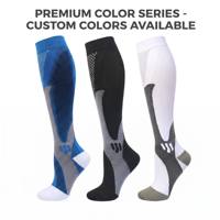 Chaussettes de compression sportives en nylon et élasthanne personnalisées pour la vente en gros, ajustement anatomique, équipement de récupération post-entraînement, bas techniques athlétiques