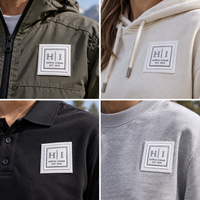 Étiquettes personnalisées en coton TPU avec logo 3D en relief, toucher doux, pour vêtements, streetwear et accessoires.