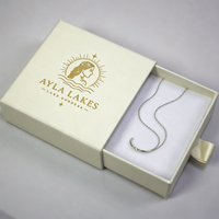 Boîte à bijoux coulissante de luxe en papier avec logo personnalisé, dorure à chaud, faible MOQ, emballage cadeau compact avec ruban pour bagues et colliers