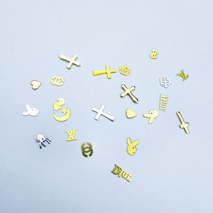 Kit professionnel de bijoux dentaires, formes géométriques variées, plaqué or 18 carats et options lumineuses, préféré par les dentistes - Product Image 1