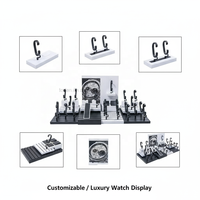 Ensemble d'affichage de montres haut de gamme personnalisable en MDF noir et blanc pour vitrine de magasin de montres