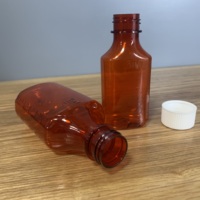 Sirop contre la toux en plastique bouteilles de qualité alimentaire étui pharmaceutique ambre sérigraphie PET résistant aux enfants médecine liquide bouteilles ovales