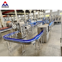 Machine de remplissage automatique d'eau pure minérale en bouteille PET, capacité 10000 BPH, pour bouteilles de 2 L