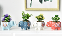 Pot de fleur en céramique émaillée en forme de petit éléphant mignon pour la maison et le jardin en gros