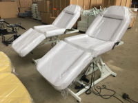 Table de massage électrique moderne à hauteur réglable avec structure métallique pour spa, salon et clinique
