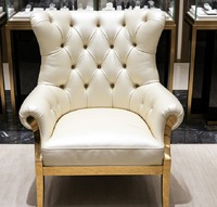 Fauteuil Chesterfield de luxe capitonné en cuir véritable avec accoudoirs, pieds en acier inoxydable doré, chaise de réception haut de gamme pour