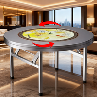 Runder Esstisch aus Edelstahl im neuen Stil mit Plattenspieler zum Essen im Hotel restaurant