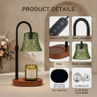 Lampe chauffe-bougie en verre vert style forêt, bras en métal noir mat réglable en hauteur, base en bois irrégulière en forme de nuage