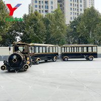 Le parc d'attractions de Chine monte le train touristique sans rail diesel électrique de Dotto pour adultes avec l'entraîneur fermé à vendre