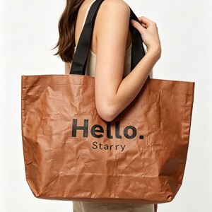 <span class=keywords><strong>Sac</strong></span> fourre-tout écologique personnalisé avec logo, en tissu non tissé, réutilisable, aspect papier kraft, pour courses, avec bandoulière noire, vente en gros - Product Image 1