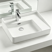Encimera de baño de cerámica ovalada de buena calidad, lavabo de tocador, lavabo de gabinete de cara de mano moderno de gran tamaño para Hotel de lujo