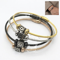 Bracelet Yiwu Aceon en acier inoxydable avec câble torsadé, fermoir magnétique ovale, double perle d'espacement, centre carré, cube estampé, éclairé