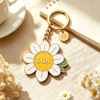 Les nouveaux porte-clés de fleurs chaudes en gros de l'artisanat en métal décorent des accessoires LOGO personnalisé porte-clés marguerite en émail dur vierge avec charme