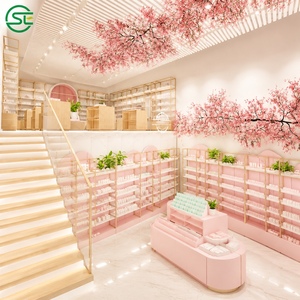 ชั้นวางสินค้าร้านค้าปลีกแบบเกาะกลางพร้อมกล่องปลูกต้นไม้ ตกแต่งด้วยกรอบสีทองและสีชมพู สำหรับจัดแสดงเครื่องสำอาง  ออกแบบตามสั่ง - Product Image 6