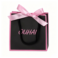Sac cadeau en papier noir avec bordure rose, poignée en corde de coton, sac fourre-tout personnalisé tendance et élégant pour l'emballage de bijoux et d'accessoires