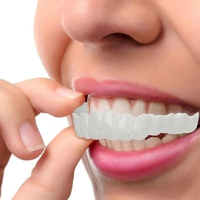 Dentier couverture en silicone plastique blanchir les dents dentaires supérieure inférieure fausses dents couverture snap sur les facettes dentaires