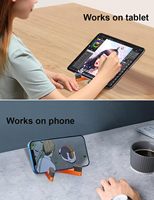 Accessoires pour téléphone Ningbo directement de l'usine, support de téléphone portable pliable en silicone en forme de V, support portable pour téléphone et mini-tablette