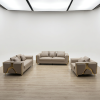 Ensemble de canapés sectionnels modernes en cuir véritable avec accents métalliques dorés, design contemporain pour appartement, salon, hôtel, confortable
