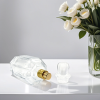 Fabricant sur mesure vente en gros 50ml 100ml atomiseur de pulvérisation en forme de cylindre rond fantaisie bouteille en verre de parfum vide