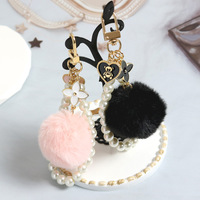Porte-clés mignons avec pompons, porte-clés boule rose, chaînes perlées, sangles, pendentif trèfle à quatre feuilles, breloque ours pour téléphone, porte-clés moelleux