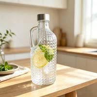 Carafe en verre de 1 litre grande capacité pour infusion à froid, avec poignée au design texturé, style moderne et minimaliste, pour thé et jus
