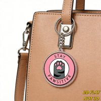 Porte-clés en acrylique Patte de chat Stay Pawsitive, breloque fantaisie ronde rose, résistant aux rayures, anneau fendu, accessoire de sac mignon pour les amoureux des chats