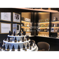 Présentoir de magasin de parfum personnalisé haut de gamme, kiosque d'exposition, magasin de conception de centre commercial, vitrine pour stand de parfum, étagère, comptoir