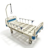 Lit d'hôpital manuel multifonctionnel avec table de lit et barre de maintien pour patients orthopédiques