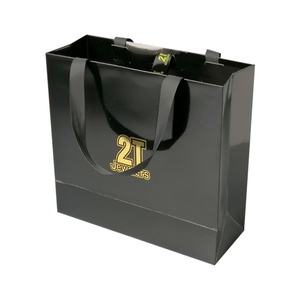 Wholesale Custom Cardboard Packaging Printed Shopping Paper Bag <b>Clothes</b> Packaging Paper Bag - Product Image 1