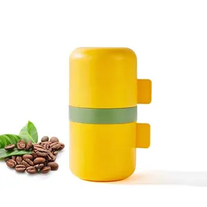 Portable ABS body ceramic grinder Layered self-cup yellow lovely coffee grinder can quickly produce powder