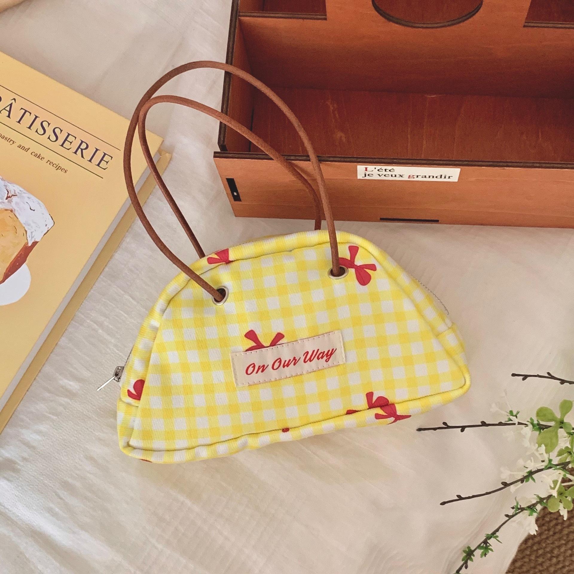 Yellow and white plaid semi-circular bag