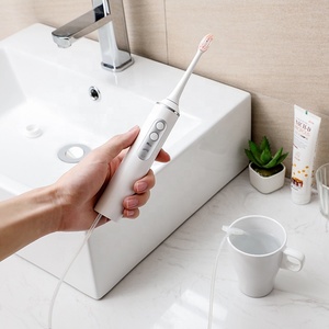 2024 Venta caliente lavado Dental cepillo de <span class=keywords><strong>dientes</strong></span> eléctrico y hilo dental logotipo personalizado limpieza Oral 2 en 1 máquina de limpieza Dental multifuncional - Product Image 5