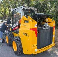 Chargeuse compacte 365B à haute efficacité avec attache rapide hydraulique pour les travaux de construction, d'aménagement paysager et municipaux