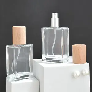 Garrafa de perfume quadrada personalizada 30ml 50ml 100ml Garrafas de vidro de perfume de cor transparente com tampa de madeira
