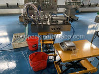 Remplisseuse de liquides à piston à double buse pour la production de petites séries de miel, de sirop et de liquide lessive