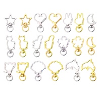 Vente Flash : Porte-clés pivotant en métal avec fermoir mousqueton, formes variées (Lune, Étoile, Fleur)