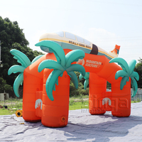 Arche gonflable géante personnalisée en forme de palmier tropical et d'avion pour les expositions, les spectacles et les événements promotionnels