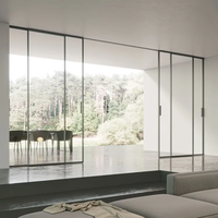 Porte coulissante moderne en verre trempé dépoli avec cadre en aluminium fin pour intérieur, système de porte télescopique en verre pour séparation de bureaux à domicile