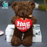 Holding Love Heart Ted Bear Poupées en peluche Saint Valentin Hug Me Teddy Bear Jouets en peluche avec un coeur