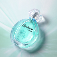 Perfume para Mujer en Botella Redonda de Vidrio Color Durazno, Tapa Transparente Facetada, Brillo Teal, Doble Radiante, Encantador y Persistente