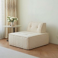 Canapé individuel cube minimaliste, unité d'assise modulable, fauteuil lounge moderne pour appartement et coin détente