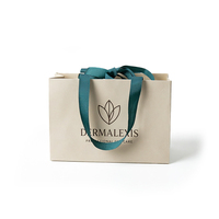 Sac en papier ivoire haut de gamme écologique et recyclable avec poignées en ruban de soie, logo estampé à chaud, emballage de luxe personnalisé pour foulard