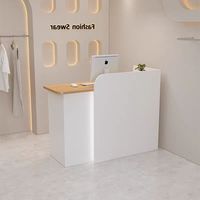 Bureau d'accueil d'angle moderne noir compact en MDF écologique avec éclairage LED, couleur et logo personnalisables, idéal pour les magasins de vêtements féminins - Offre Spéciale