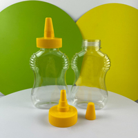 Bouteille de sauce ronde en plastique PET transparent de 16 oz avec capuchon en PP côtelé noir à col 38/400 avec doublure pour vinaigrettes ketchup marinades