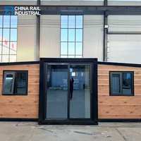 Structure pliable à double aile et toit plat de 20 pieds, avec deux chambres, un salon, une cuisine et une salle de bain avec séparation sec-humide